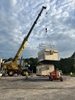 Two Tandemloc Telescopic beams lifting a unit.